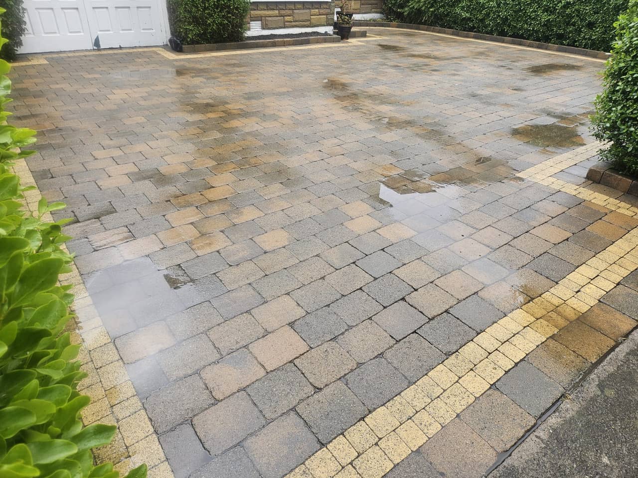 The same block paving driveway after cleaning, buff border and colour mix restored