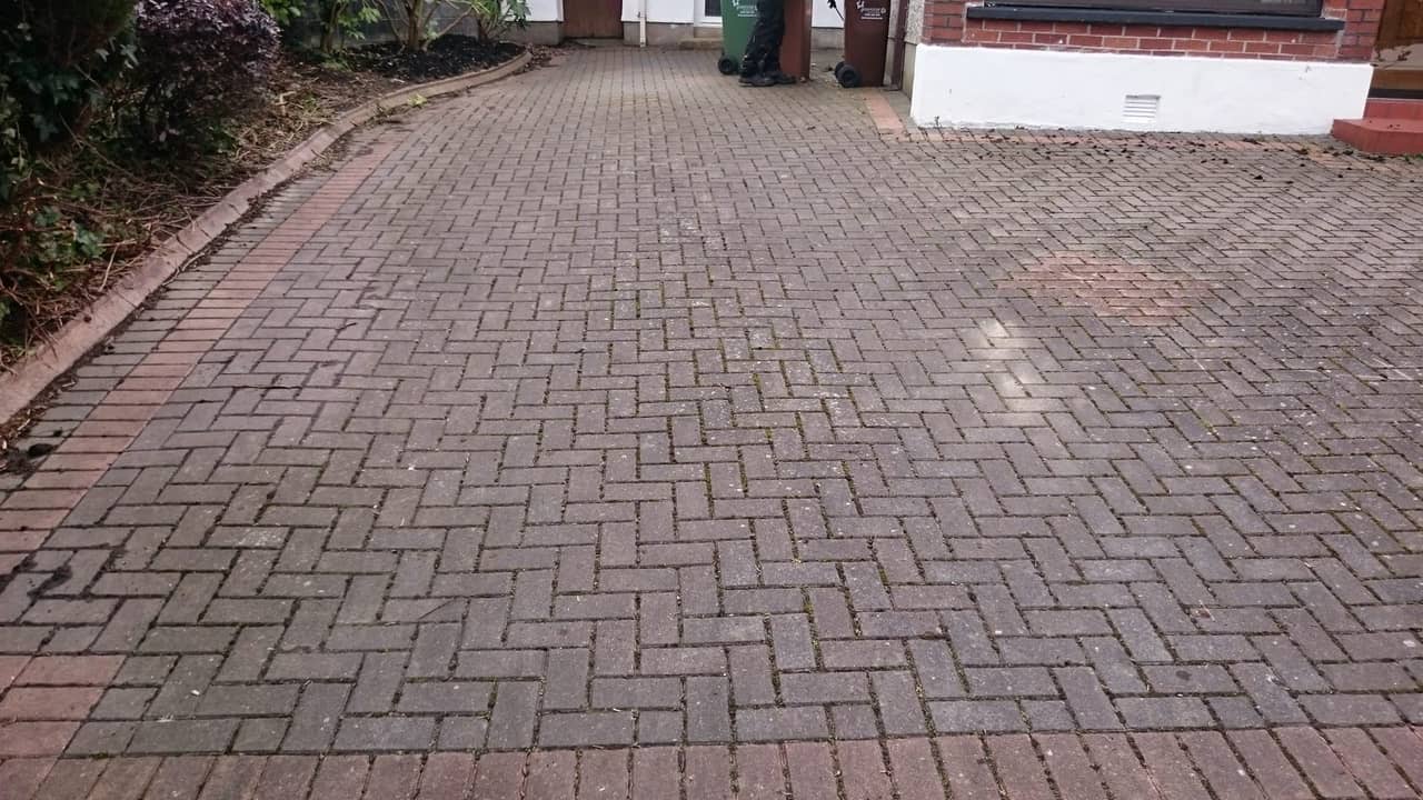 Red and charcoal block paving cleaned
