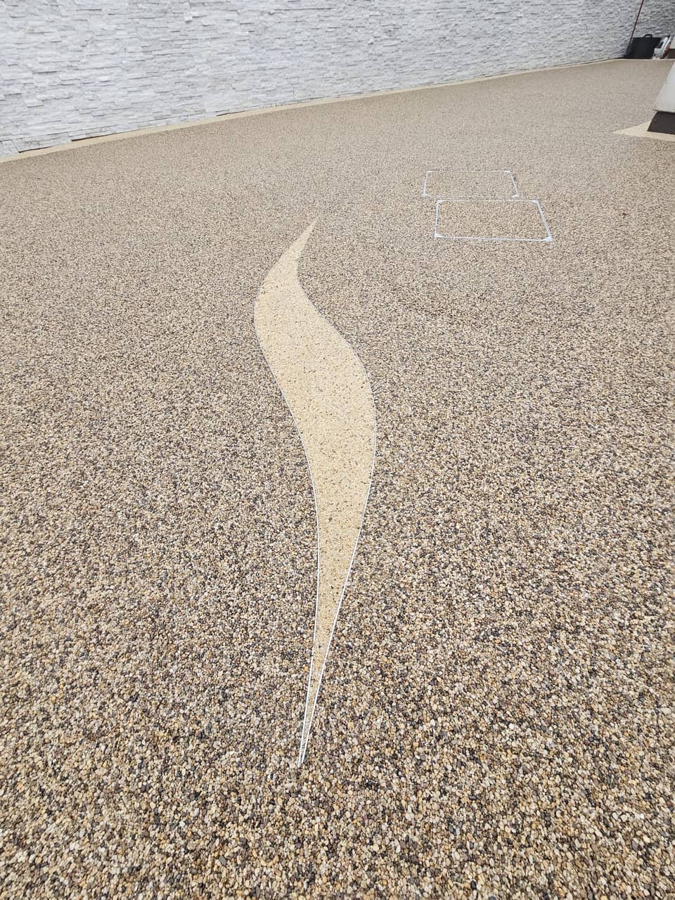 Resin driveway with a wave design inlay
