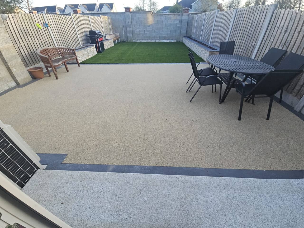 Silver granite steps with Amalfi resin, artificial grass and quartz-clad planters, Ratoath