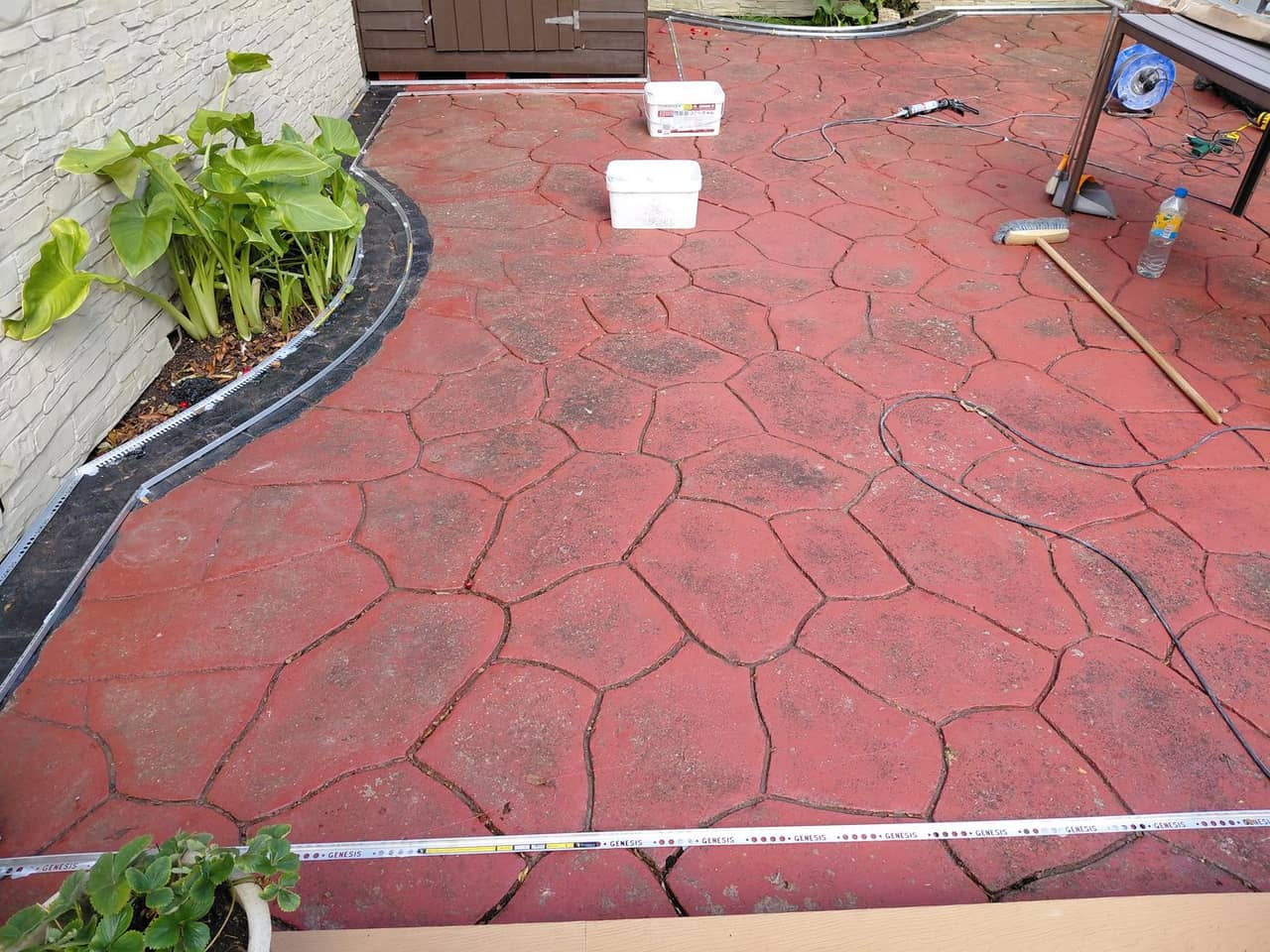 Old red imprinted concrete before resin