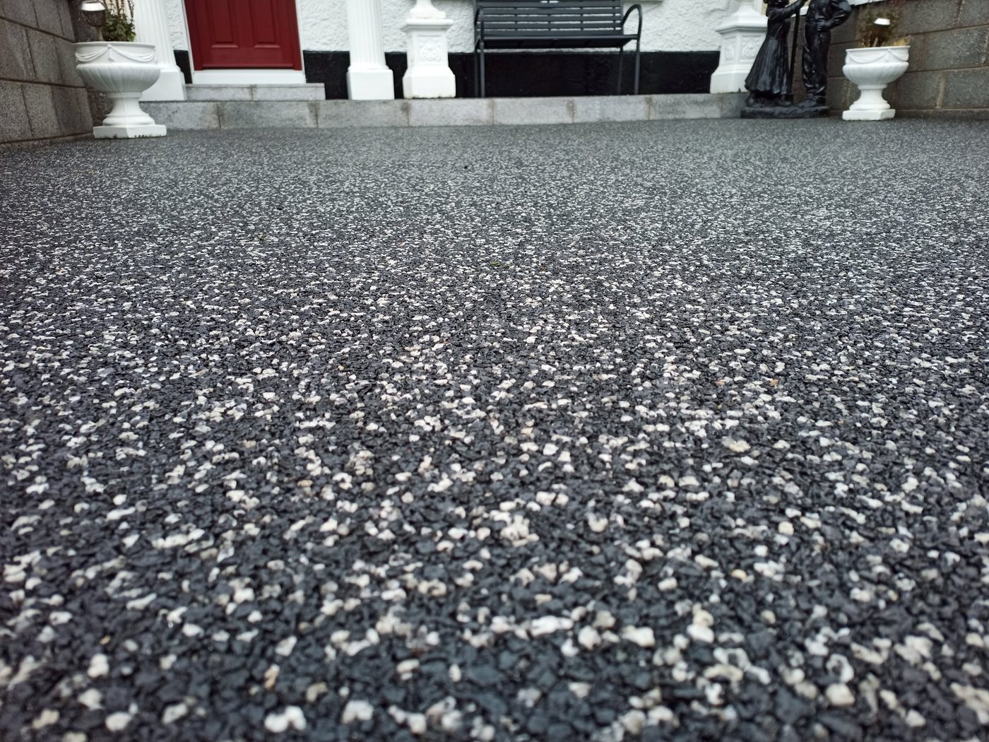 Dark resin bound patio with seating area