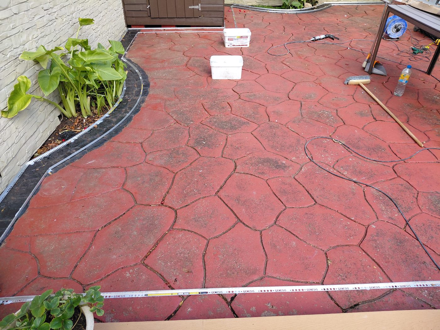 Old red imprinted concrete before resin