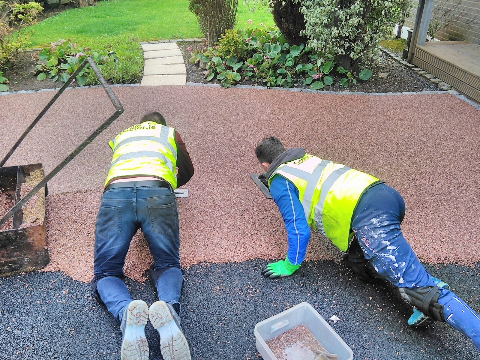 The Driveway Doctor team installing a resin bound driveway